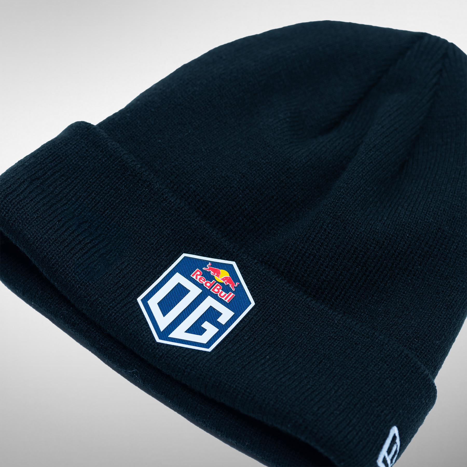 Dark blue beanie featuring the OG logo at the front and New Era logo on the side.