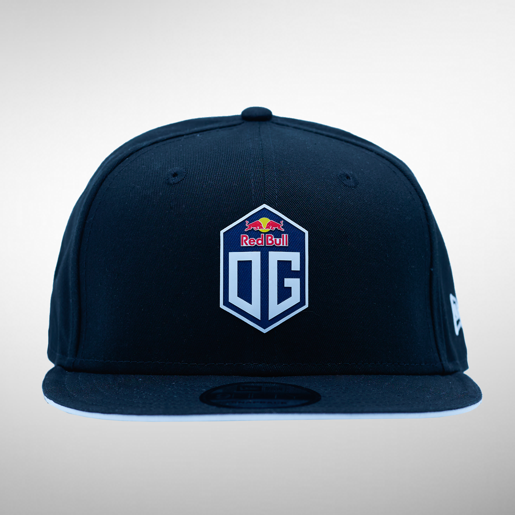 Front view of a snapback cap in dark blue, featuring the OG logo prominently displayed on the front.