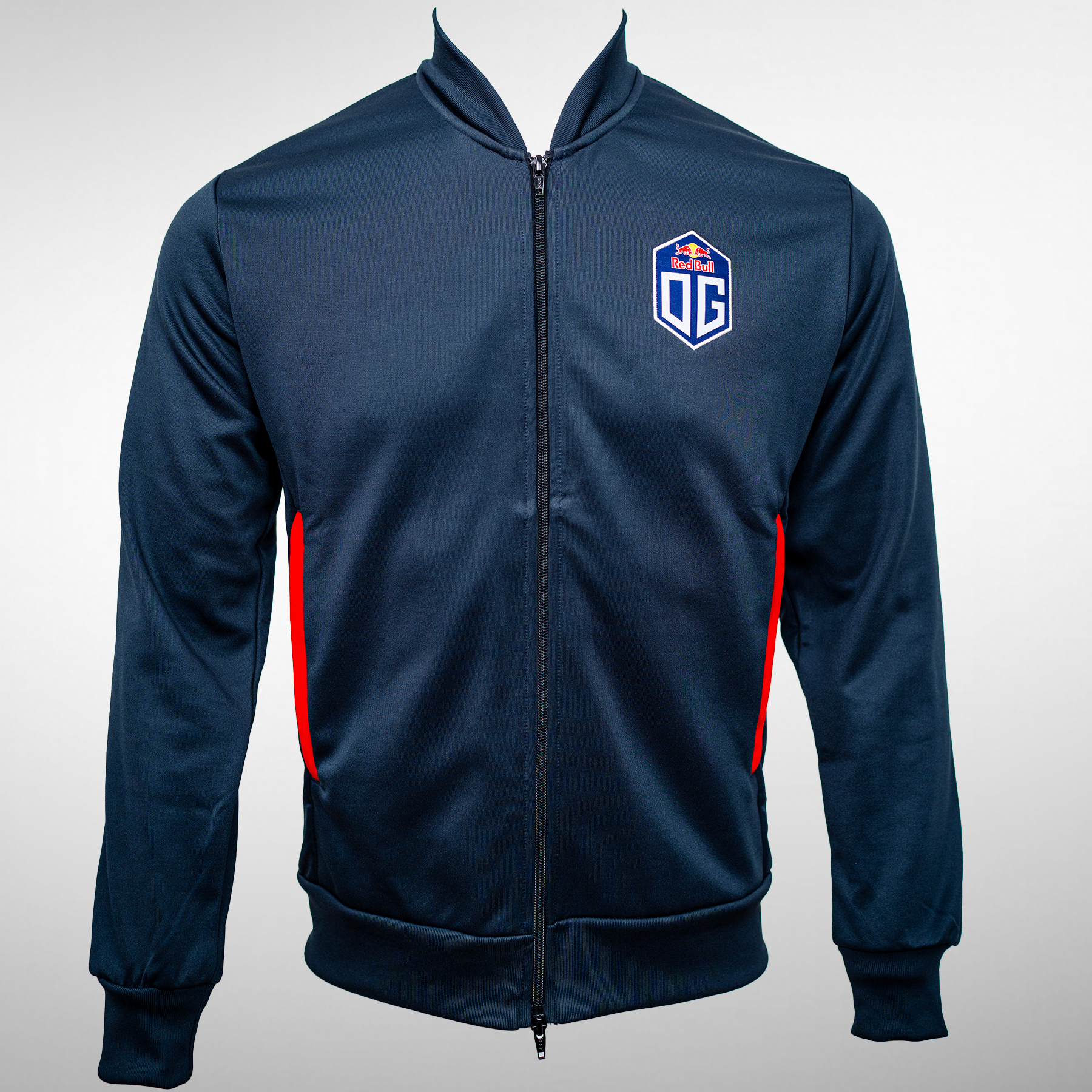 Front view of a pro jacket in dark blue, with the OG Esports logo prominently displayed on the left chest. The jacket features red highlights at the pockets